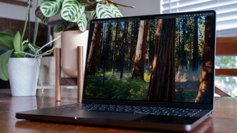 Apple MacBook Pro with nano-texture display on a wooden table