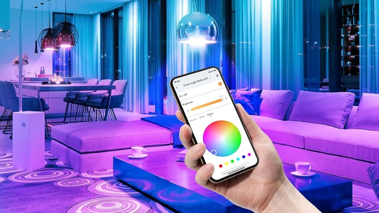 The AiDot LED lights installed as someone uses the smartphone application to change light colors
