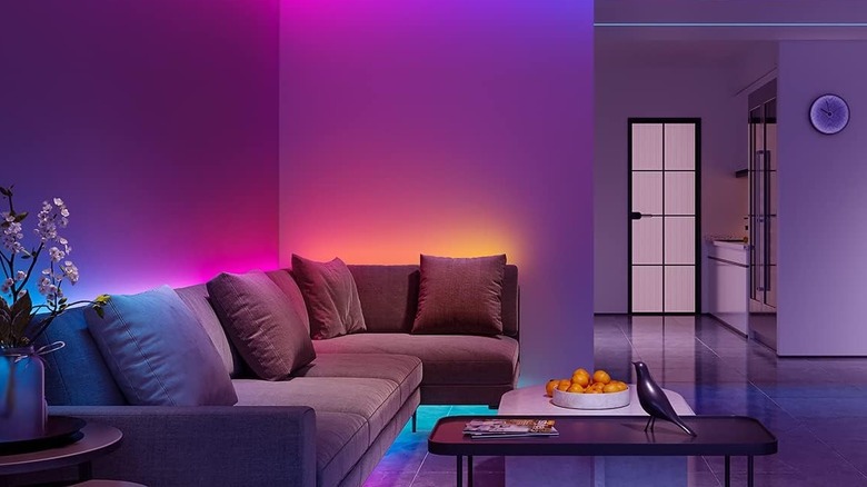 Govee Light Strips attached to the side of walls surrounding a living room
