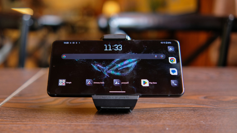 The ASUS ROG Phone 9 Pro placed horizontally on a stand