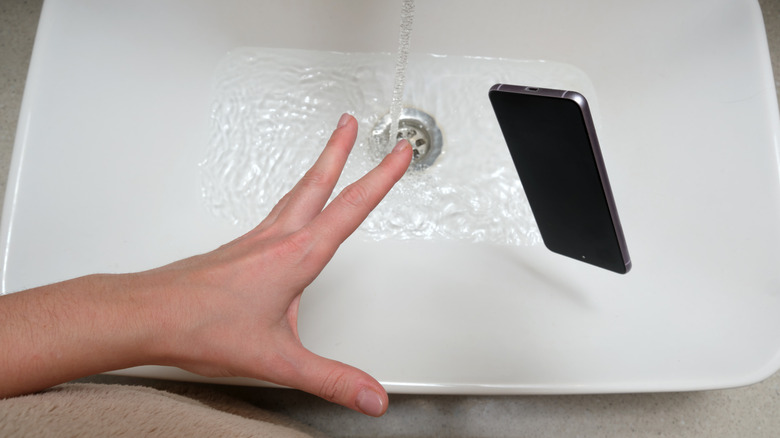 Dropping a smartphone in the sink