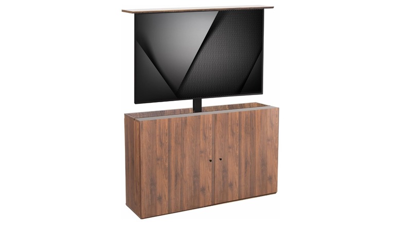 A TV rising out of a woodgrain TV lift cabinet.