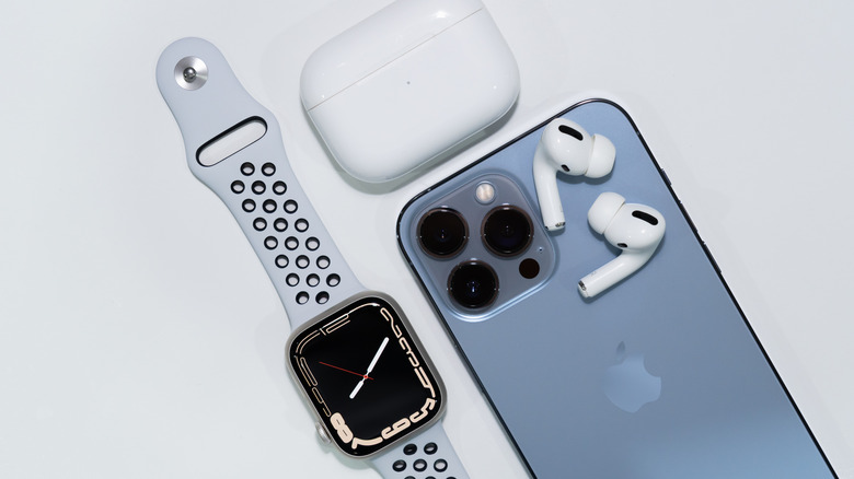 iPhone 13 Pro max with Airpods pro and an Apple watch