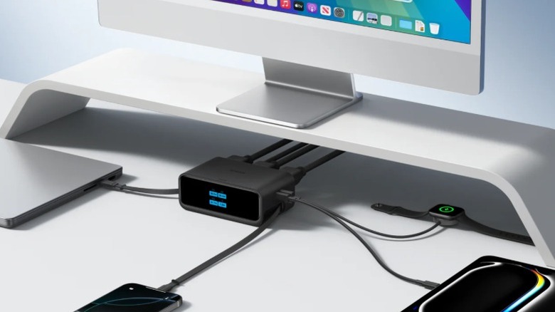 An image of the Anker Nano Charging Station providing power to Apple Watch, iPad, iPhone, Macbook, and an iMac