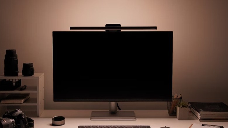 A product shot of the BenQ ScreenBar Halo 2 monitor light bar sitting on top of monitor