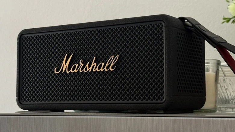 An image of the Marshall Middleton 2 Bluetooth speaker sat on top of a desk surface