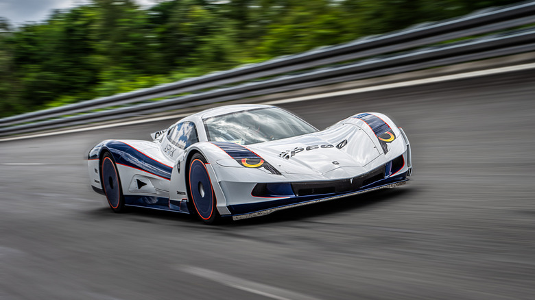 The Aspark Owl SP600 driving on a racetrack