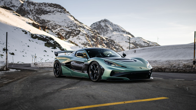 The Rimac Nevera R parked on side of a road among the mountains