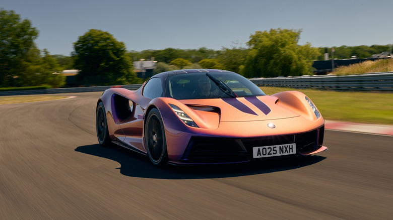 The Lotus Evija driving around a racetrack