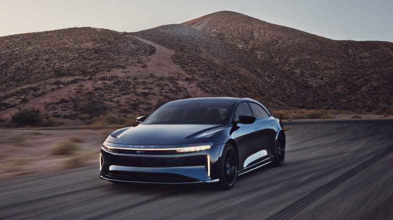 The Lucid Air Sapphire driving on a desert road