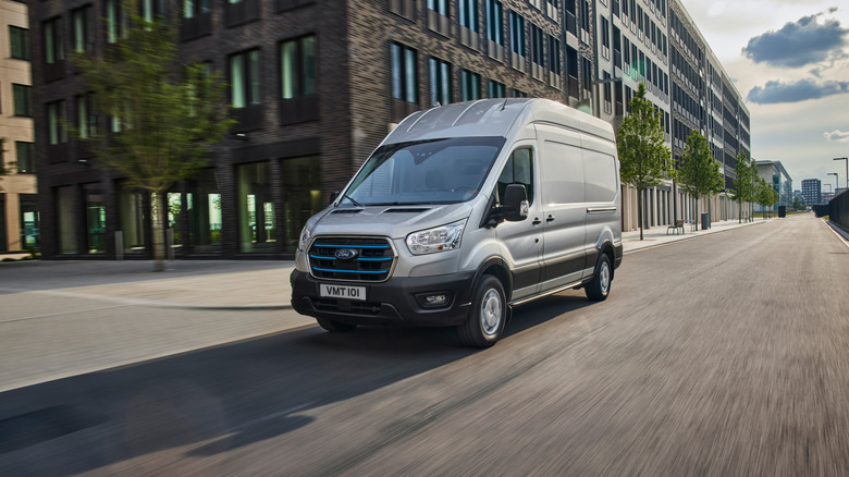 The Ford E-Transit Cargo Van driving in the city streets