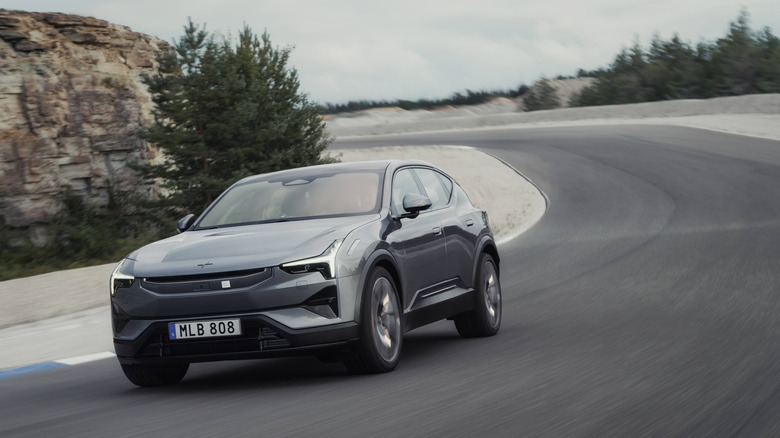 The Polestar 3 driving down a sandy road