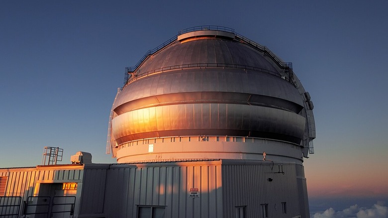 Gemini North Telescope at sunset. Clouds can be seen in the background, notably beneath the telescope