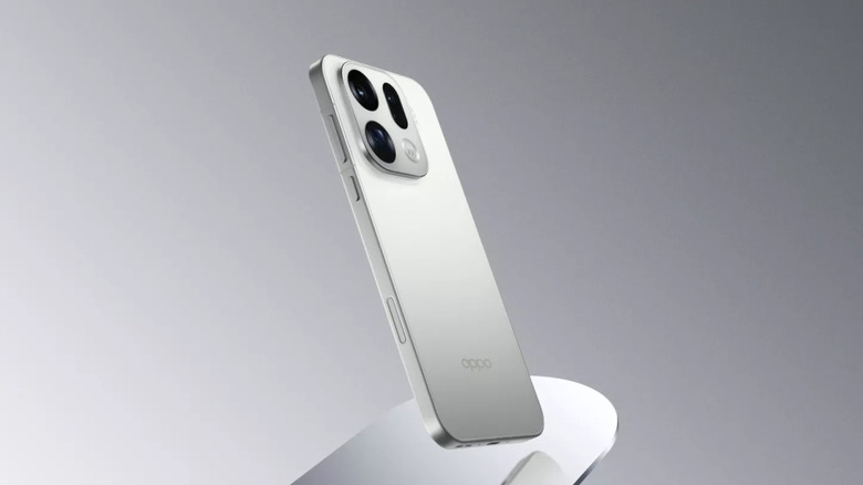 OPPO Find X9 Pro in the silk white color on a gray background