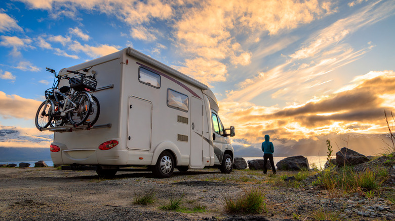 The rear of an RV parked facing the sunset