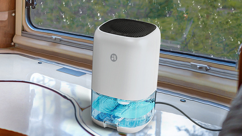 The Tabyik DH-CS01 dehumidifier inside an RV, near the window.