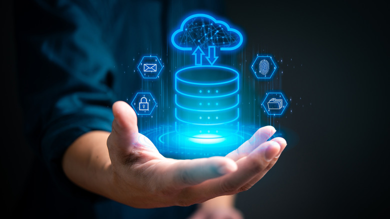 Holographic cloud storage image hovering above man's hand
