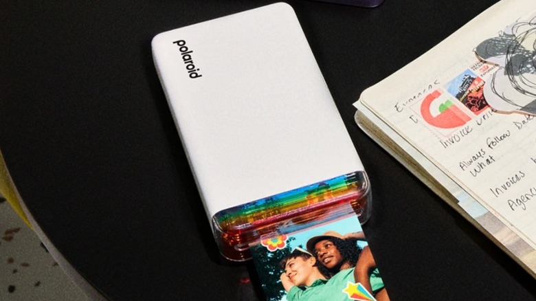 A picture of the Polaroid Hi-Print 2x3 portable printer printing an image.