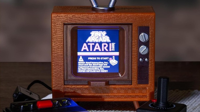 The home screen of the Super Impulse Tiny Arcade Atari 2600 mini console.