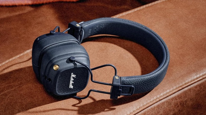 The Marshall Major V wireless headphones on a leather surface,