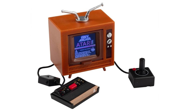 The Super Impulse Tiny Arcade Atari 2600 mini console on a white background.
