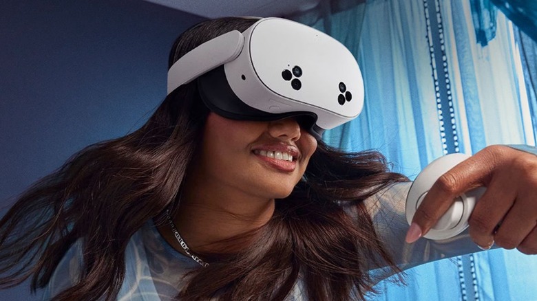 A woman wearing the Meta Quest 3S VR headset to play video games.