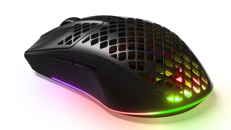 The SteelSeries Aerox 3 gaming mouse with its lights activated, on a white background.