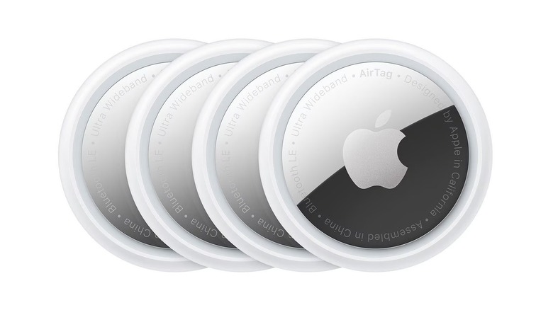 Four units of the Apple AirTag (1st Gen) item tracker on a white background.