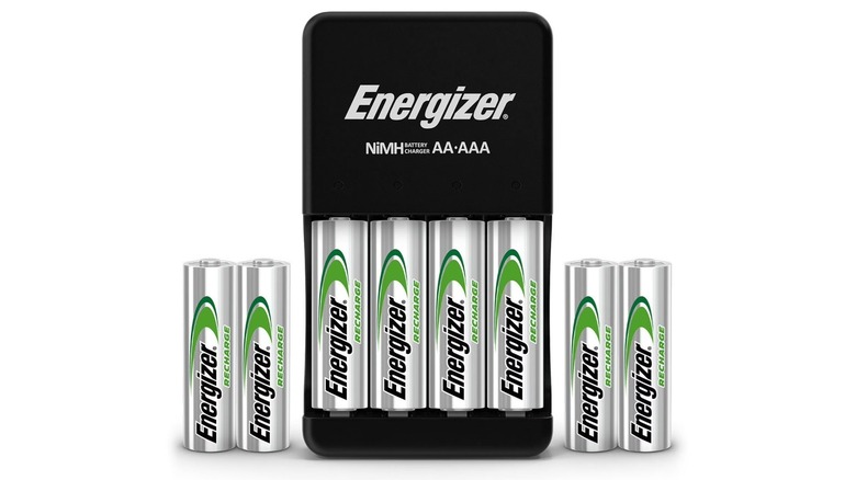 Energizer Recharge Plus rechargeable batteries with their charger, on a white background.