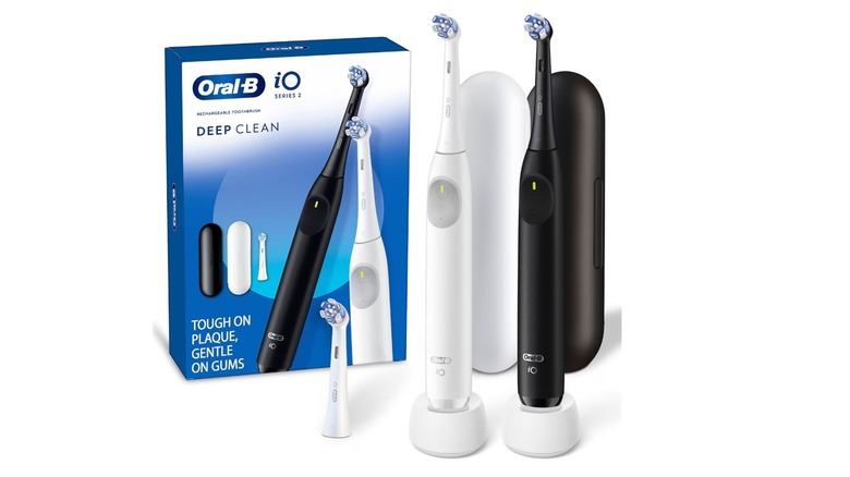 Two units of the Oral-B iO Series 2 electric toothbrush with their box, on a white background.