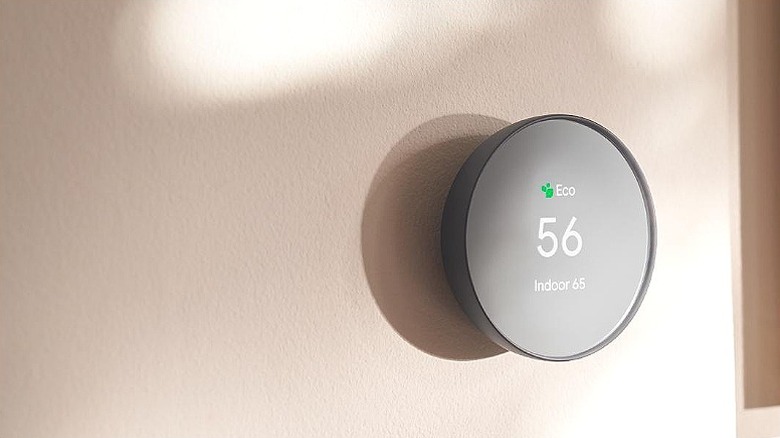 Google Nest thermostat placed on a wall