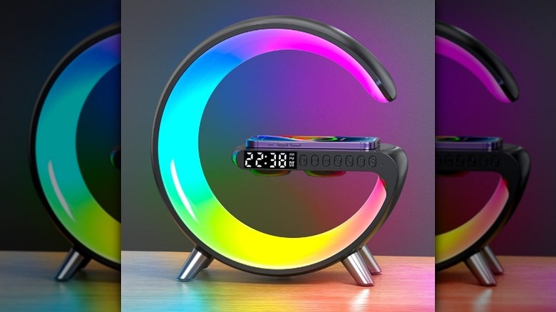 Smartphone mounted on a smart LED table lamp with RGB lighting