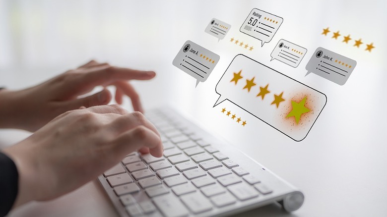Holographic images of customer reviews hovering above a keyboard