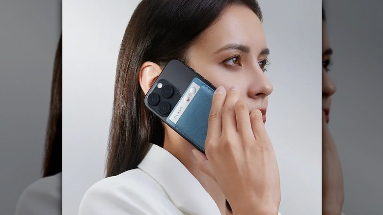 Woman using Plaud Note AI with her smartphone on call