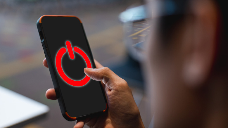 A power symbol on a smartphone screen
