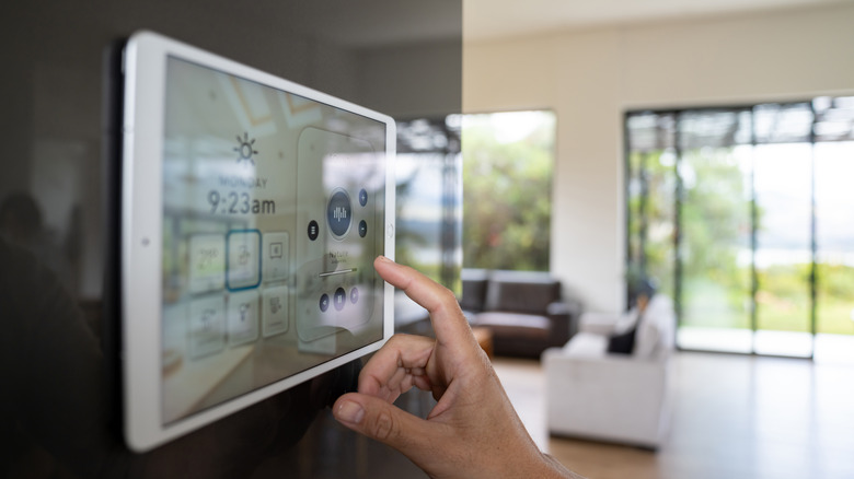 Person using smart home touchscreen control