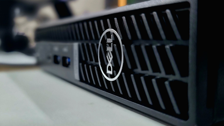 A closeup of a Dell mini PC with prominent front intake vents.