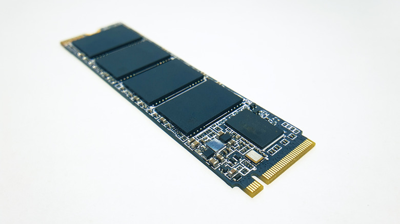 An NVMe M.2 SSD on a blank grey background.