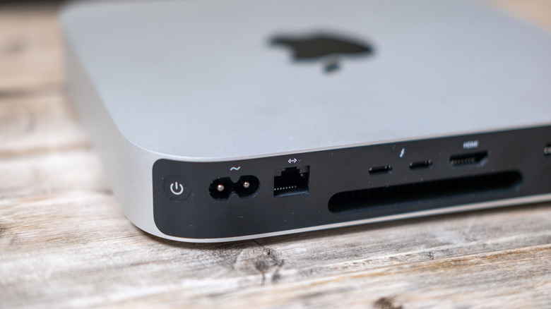An Apple M1 Mac Mini seen from the rear with various ports visible, including its Ethernet port.