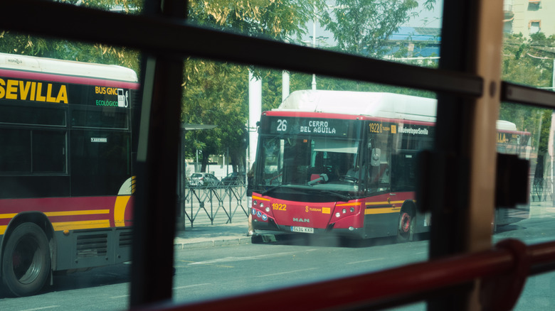 Buses passing by as seen from a window