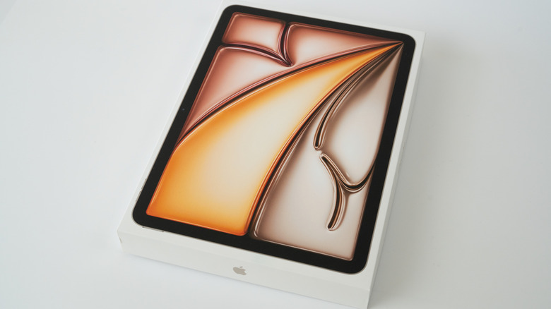 The top of an iPad Air box featuring an orange-toned abstract graphic on a gray background.