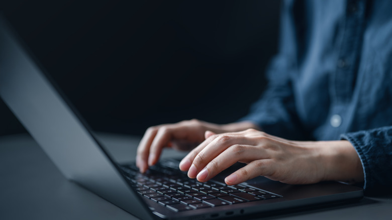 Generic user on laptop, maybe doing a crime