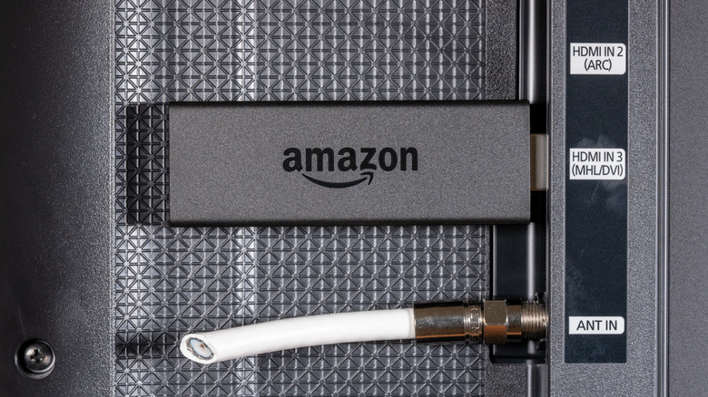 An Amazon Fire TV Stick plugged into an HMDI port.