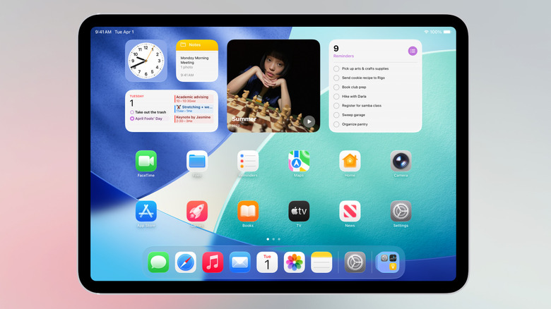 iPad showing home screen with apps and widgets.