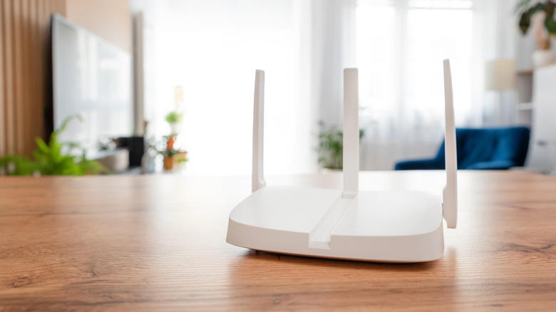 A Wi-Fi router on a table in the living room.