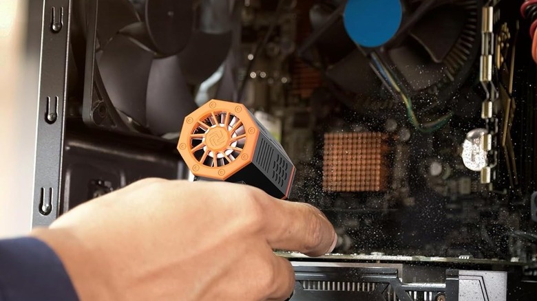 An Air Duster blowing off dust inside a PC
