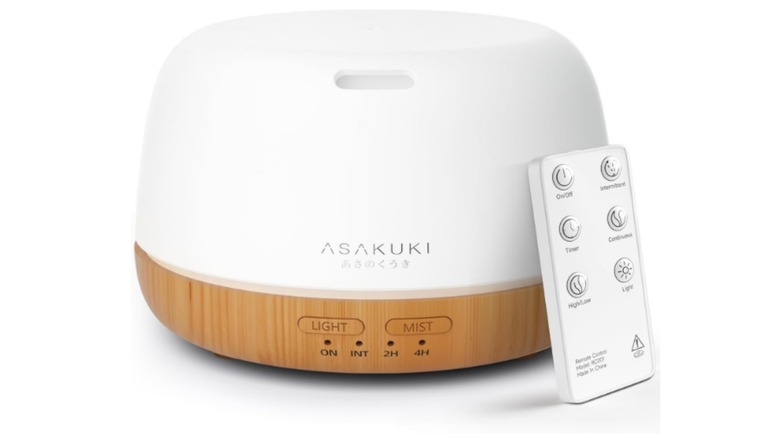 A white ASAKUKI Essential Oil Diffuser alonside the remote control