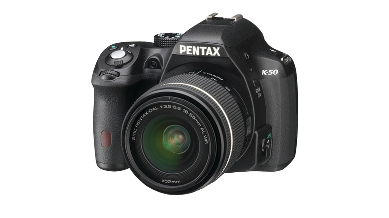 A Pentax K‑50 with 18-55mm lens attached.