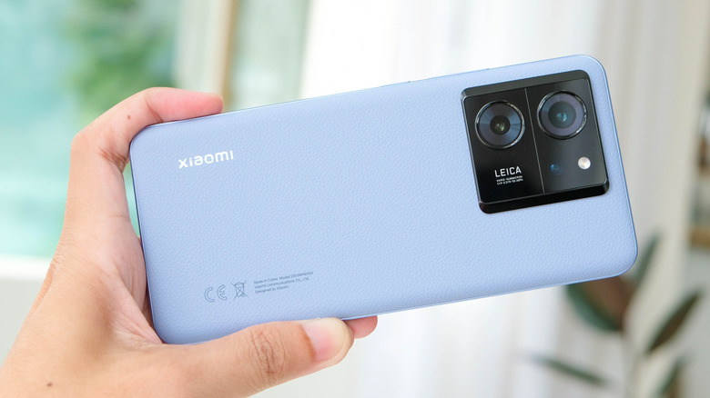 Hand holding a Xiaomi 13T Pro phone