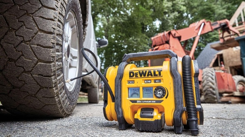 DeWalt tire inflator pumping up a car's tire
